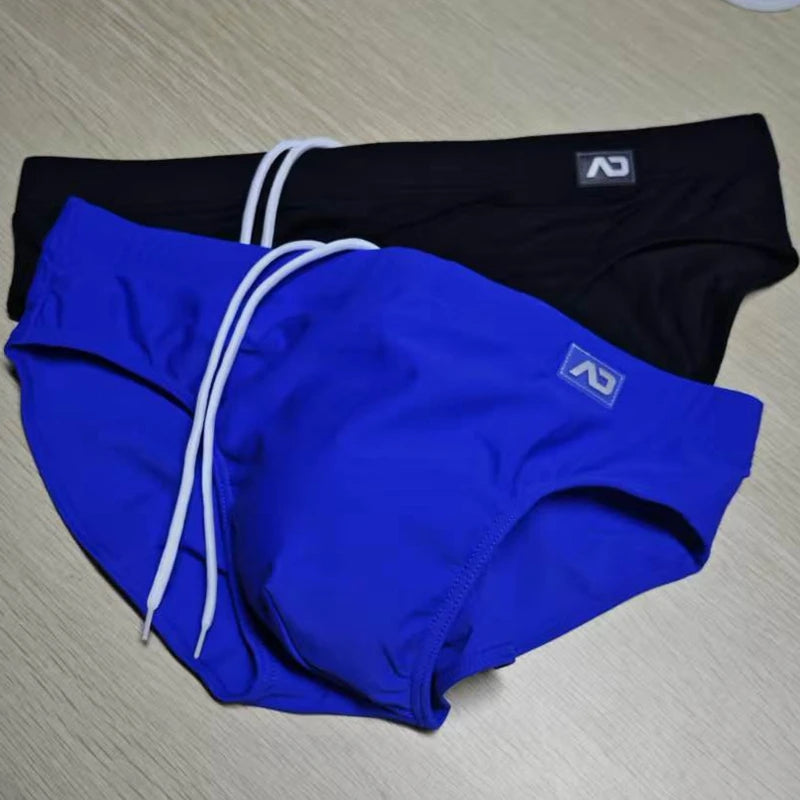 2026Combination trunks men's low-rise briefs solid color nylon swimming trunks cup anti-embarrassment beach pants tethered BS420