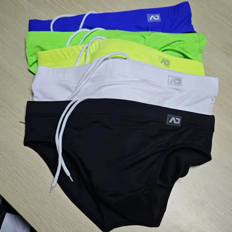 2026Combination trunks men's low-rise briefs solid color nylon swimming trunks cup anti-embarrassment beach pants tethered BS420