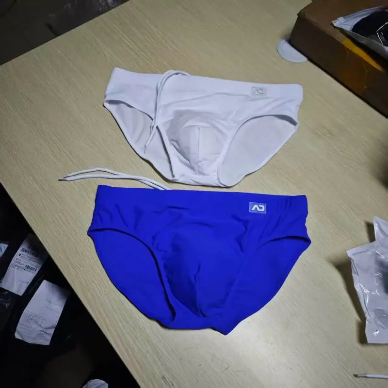 2026Combination trunks men's low-rise briefs solid color nylon swimming trunks cup anti-embarrassment beach pants tethered BS420