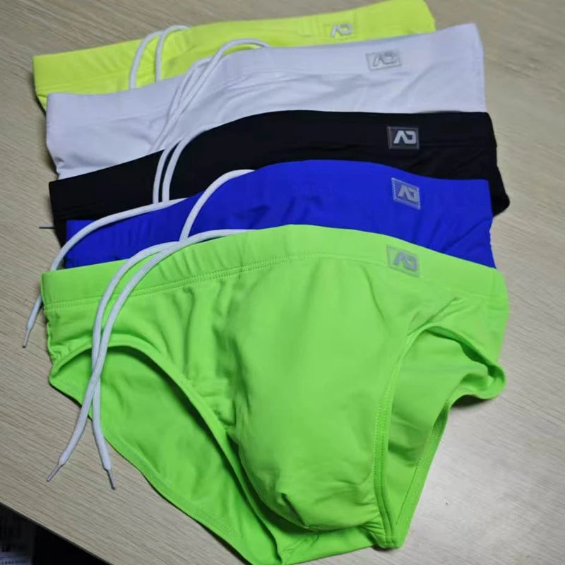 2026Combination trunks men's low-rise briefs solid color nylon swimming trunks cup anti-embarrassment beach pants tethered BS420