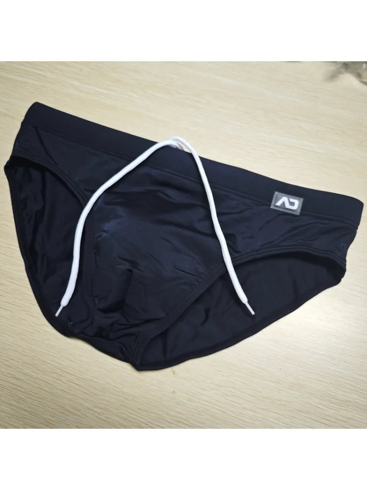 2026Combination trunks men's low-rise briefs solid color nylon swimming trunks cup anti-embarrassment beach pants tethered BS420