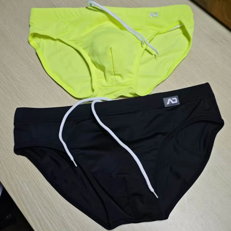 2026Combination trunks men's low-rise briefs solid color nylon swimming trunks cup anti-embarrassment beach pants tethered BS420