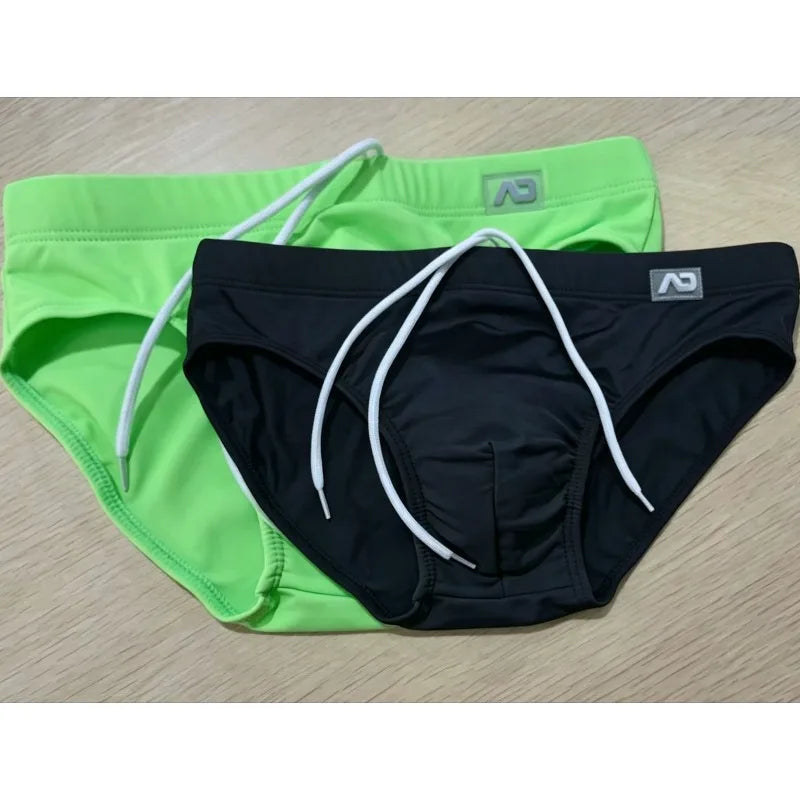2026Combination trunks men's low-rise briefs solid color nylon swimming trunks cup anti-embarrassment beach pants tethered BS420