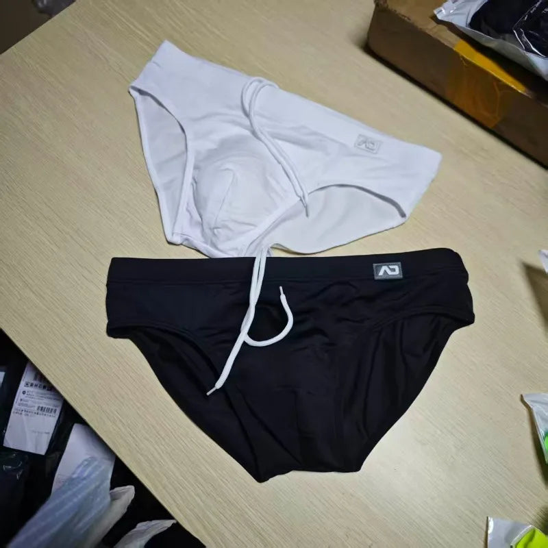 2026Combination trunks men's low-rise briefs solid color nylon swimming trunks cup anti-embarrassment beach pants tethered BS420